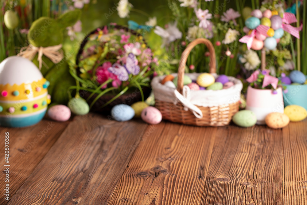 Easter theme. Easter eggs. Colorful tulips. Easter baskets. Rustic wooden table. 