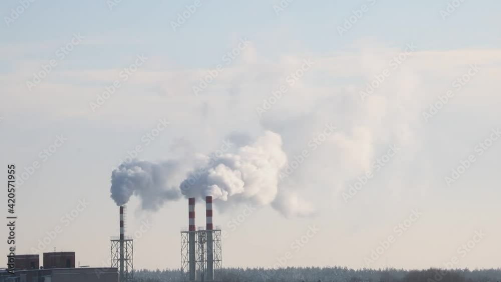 Smoke is coming from the chimney of an industrial enterprise. Smoke is coming from the chimney of an industrial enterprise.