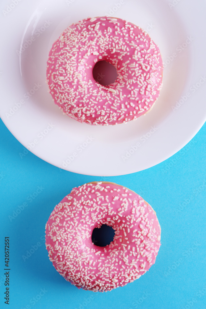 Two pink donuts