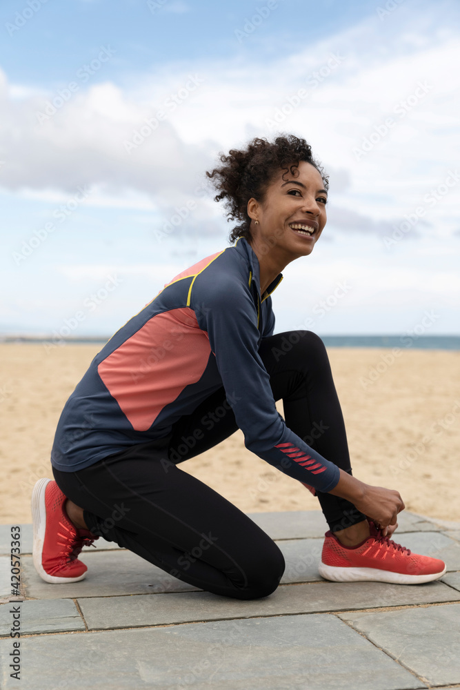 Smiling Woman Getting Ready for a Run Smiling Woman Getting Ready for a Run