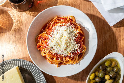spaghetti puttanesca dish on table