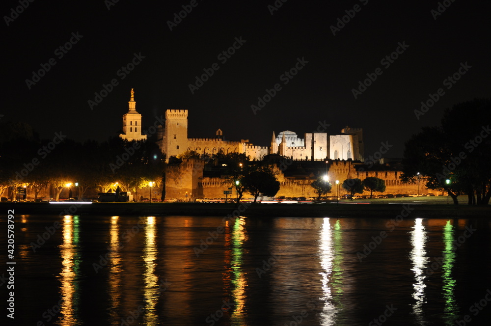 Fototapeta premium Night view of the illuminated Papal Palace in Avignon, France