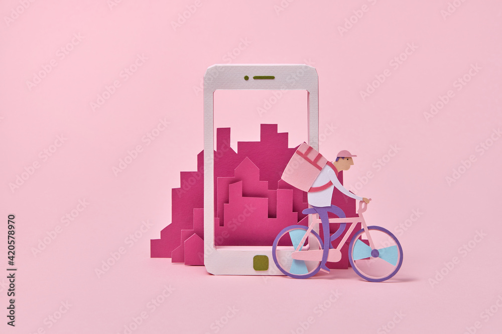 Handcraft courier on a bicycle riding along smartphone. Handcraft courier on a bicycle riding along smartphone.