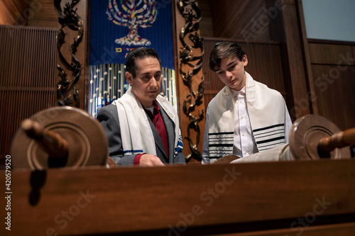 Synagogue: Rabbi Working With Male Teen On Torah Portion