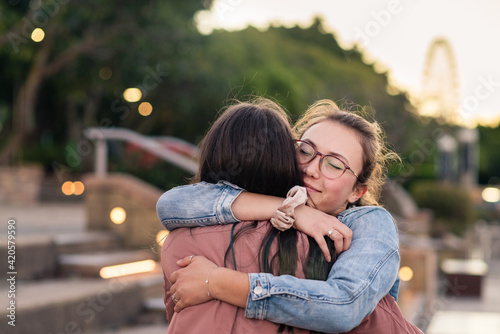 two friends hugging photo
