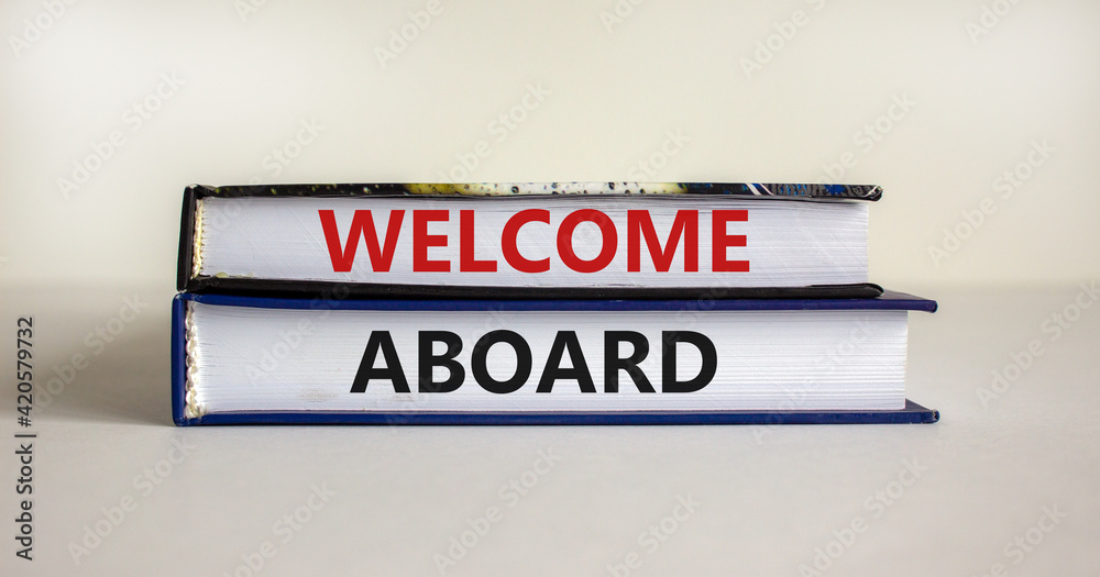 Welcome aboard symbol. Books with words 'Welcome aboard'. Beautiful white background. Business, welcome aboard concept, copy space.