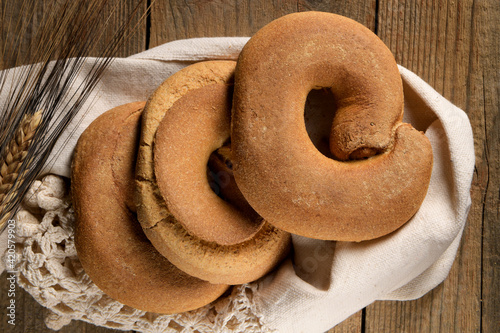 Tipical summer dish of Puglia - friselle. Classical apulian dried bread called freselle. Healthy vegetarian food, above view, with copy space photo