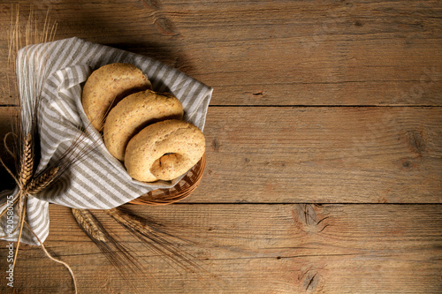 Tipical summer dish of Puglia - friselle. Classical apulian dried bread called freselle. Healthy vegetarian food, above view, with copy spaceat photo