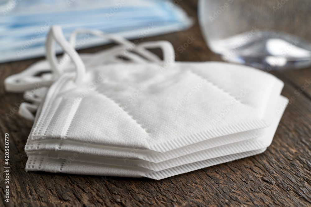 A stack of white FFP2 or KN95 respirators, destined to prevent the coronavirus COVID-19 pandemic A stack of white FFP2 or KN95 respirators, destined to prevent the coronavirus COVID-19 pandemic