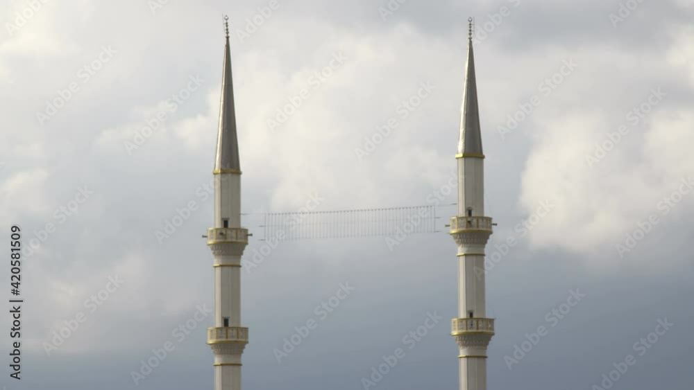 Two minarets on a background of blue morning sky. 4k timelapse. Two minarets on a background of blue morning sky. 4k timelapse.