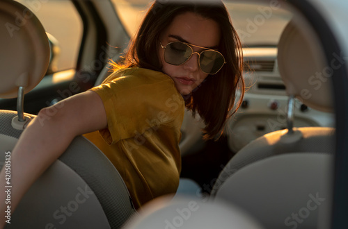 A Woman driving a car photo