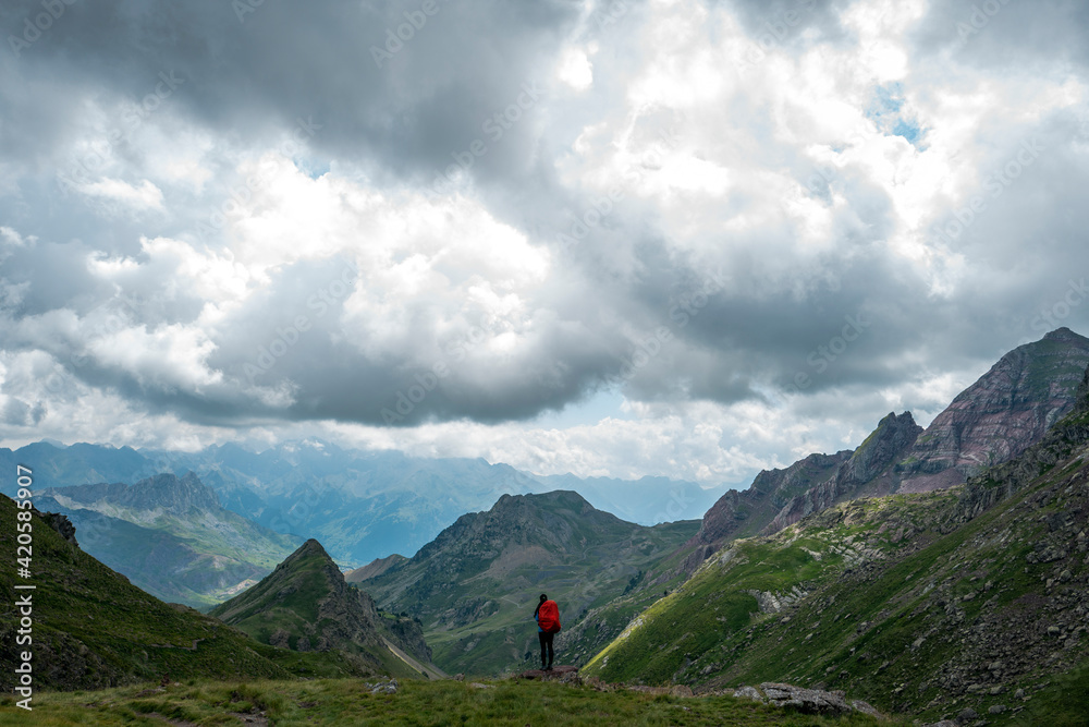 Female hiker looking at mountains Female hiker looking at mountains