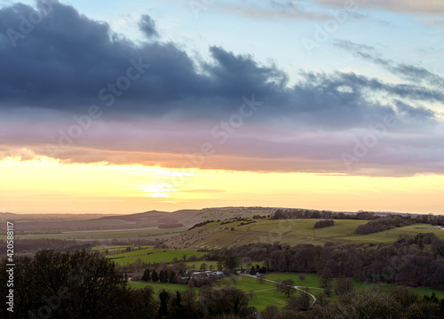 scenic Westerly view over as the golden sun sets over Oare and across the Pewsey Vale valley