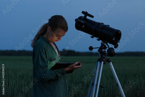 Wallpaper Mural Woman using tablet near telescope Torontodigital.ca