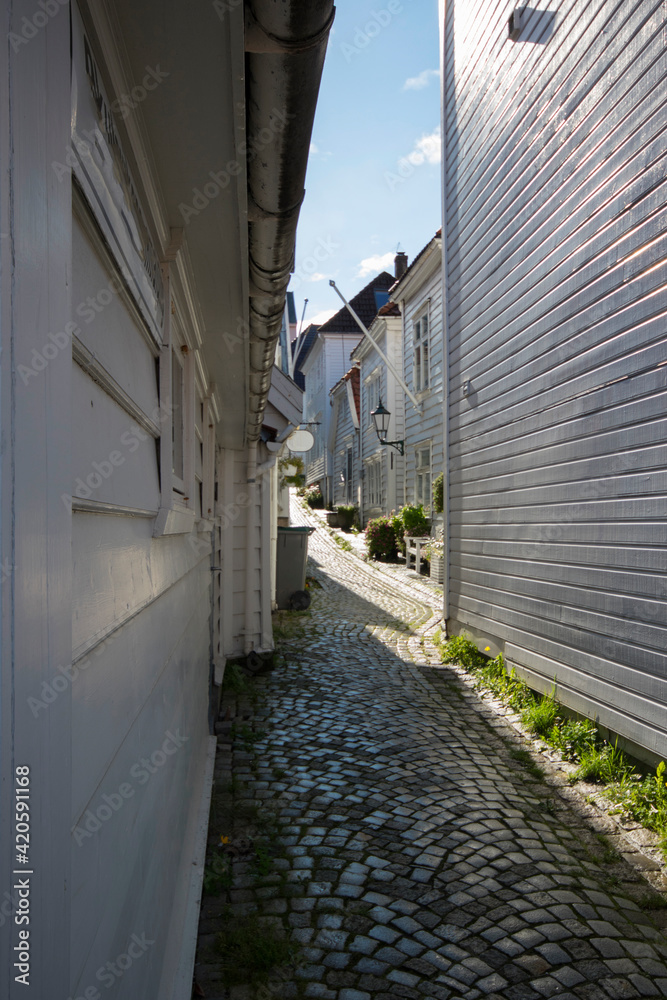 Norway. Narrow street between white wooden houses