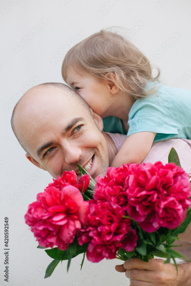 Father with flowers and little child Father with flowers and little child