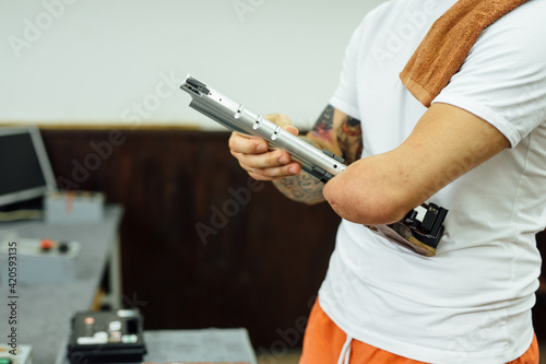 Anonymous Disabled Man Preparing For A Gun Shooting Practise photo