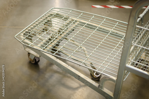 Metal trolley for goods and products in the store.