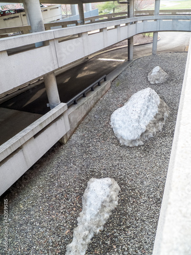 last remnants of snow piles in parking lot mid of April