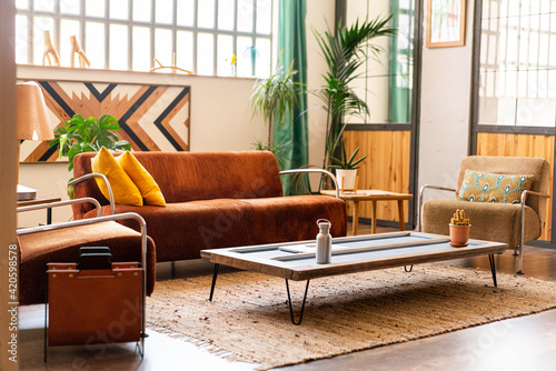 Beautiful living room in bright industrial loft. Indoors decoration. photo