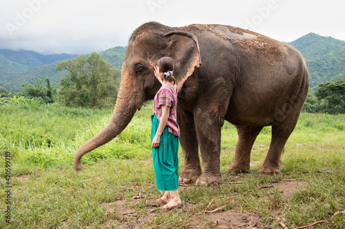 Photography Girl stroking an elephant - North of Chiang Mai, Thailand