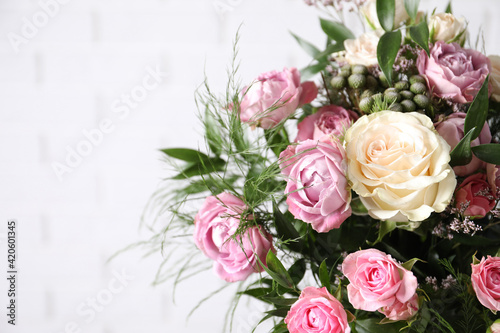 Beautiful bouquet with roses on white background  closeup. Space for text