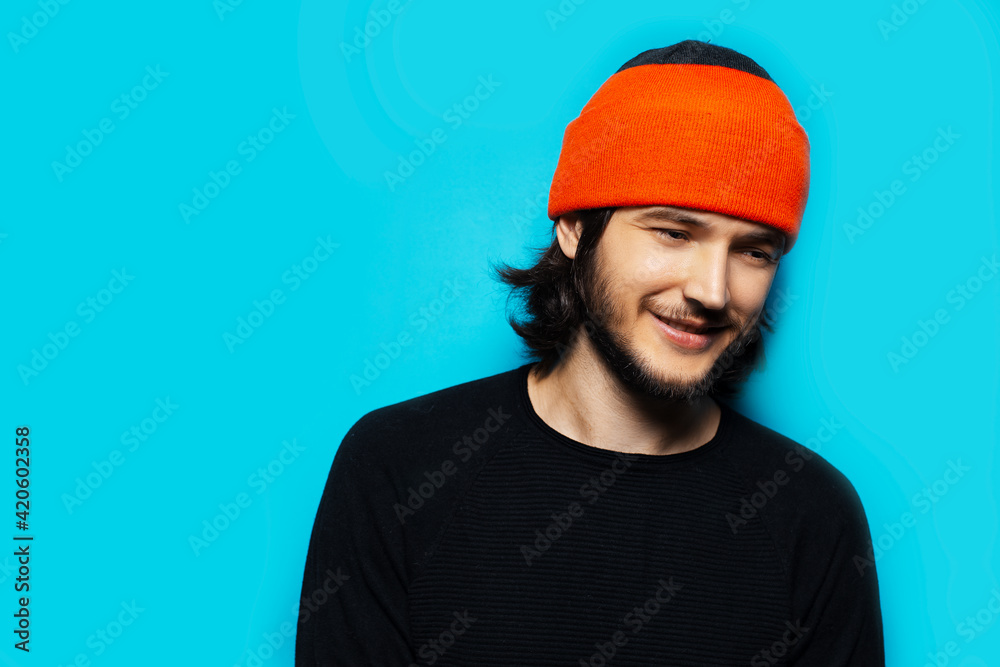 Studio portrait of young cool man on background of blue color. Studio portrait of young cool man on background of blue color.