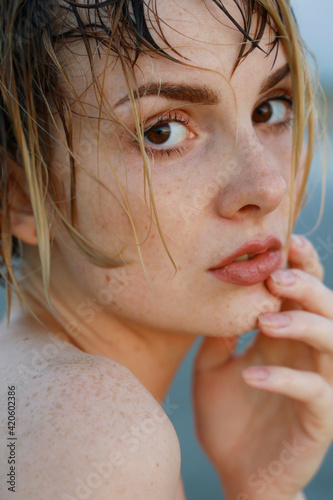 portrait of young woman with wet hair