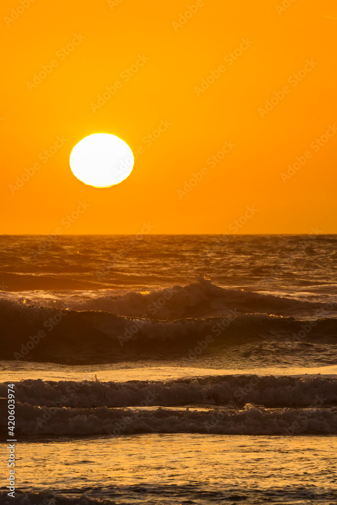USA, Oregon, Bandon Beach. Sunset on ocean surf.