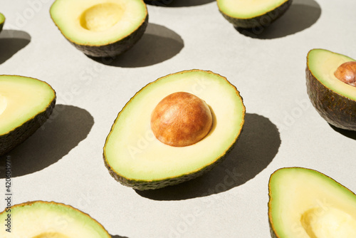 Halves of avocado with seeds photo