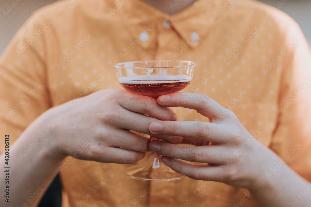 Person Holding Cocktail Glass with Sparkling Cider Person Holding Cocktail Glass with Sparkling Cider