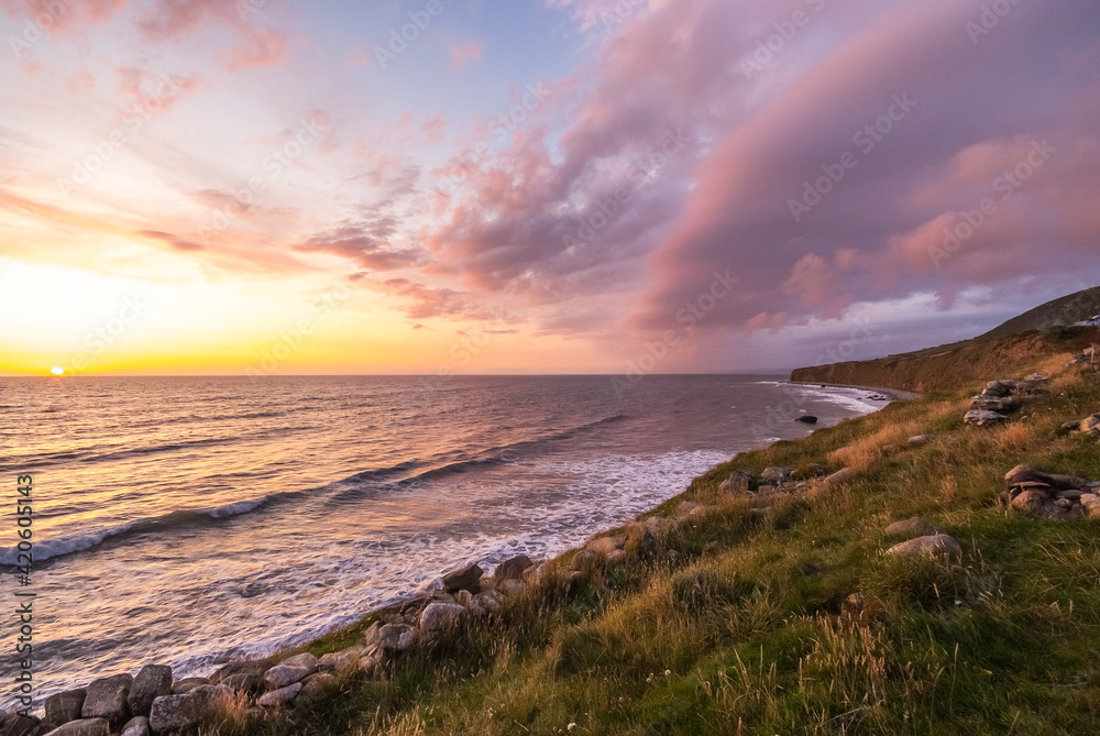 amazing sunset over the sea, coast of wales, england 