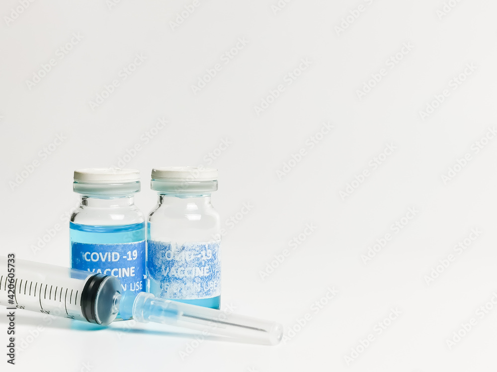 Close up photo rejected and torn label covid 19 vaccine doses with syringe. Selective focus. Close up photo rejected and torn label covid 19 vaccine doses with syringe. Selective focus.