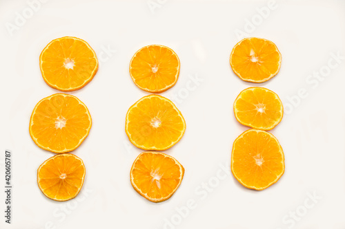 Slices of orange isolated on white background. Flat lay  top view