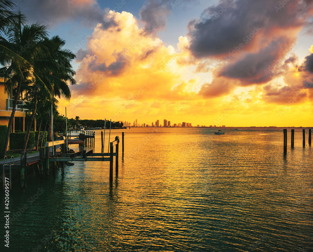sunset over the sea beautiful summer miami Florida ocean palms tropical coat boat pier 