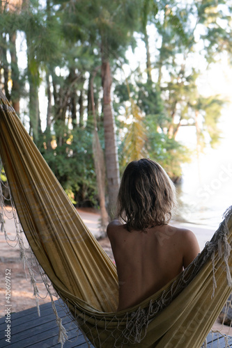 Woman on hammcok in a tropic island photo