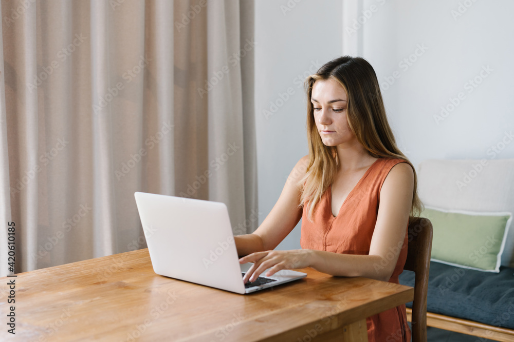Female freelancer using netbook at home Female freelancer using netbook at home