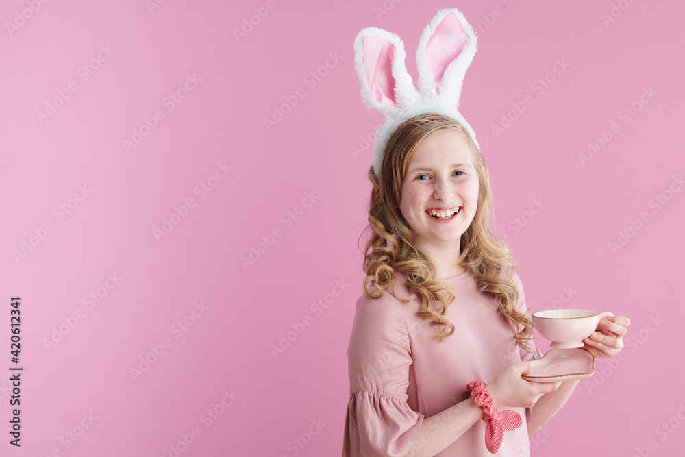 Portrait of happy modern child with long wavy blond hair on pink Portrait of happy modern child with long wavy blond hair on pink