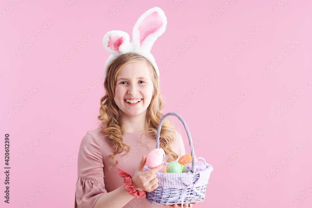 Portrait of smiling stylish child in pink dress on pink Portrait of smiling stylish child in pink dress on pink