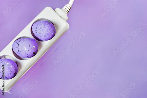 Happy Easter greeting card with electrical switch on purple background