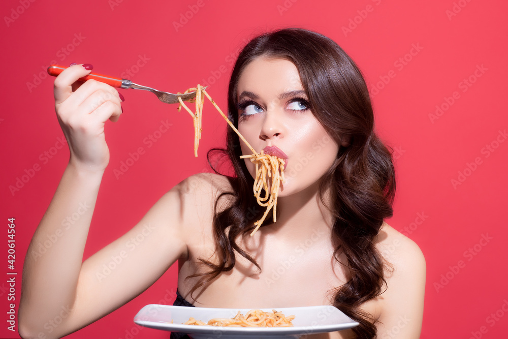 Italian food. Spaghetti pasta. Italian cuisine. Sexy girl eating pasta. Healthy menu. Stock
