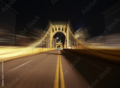 Night view of yellow bridge...