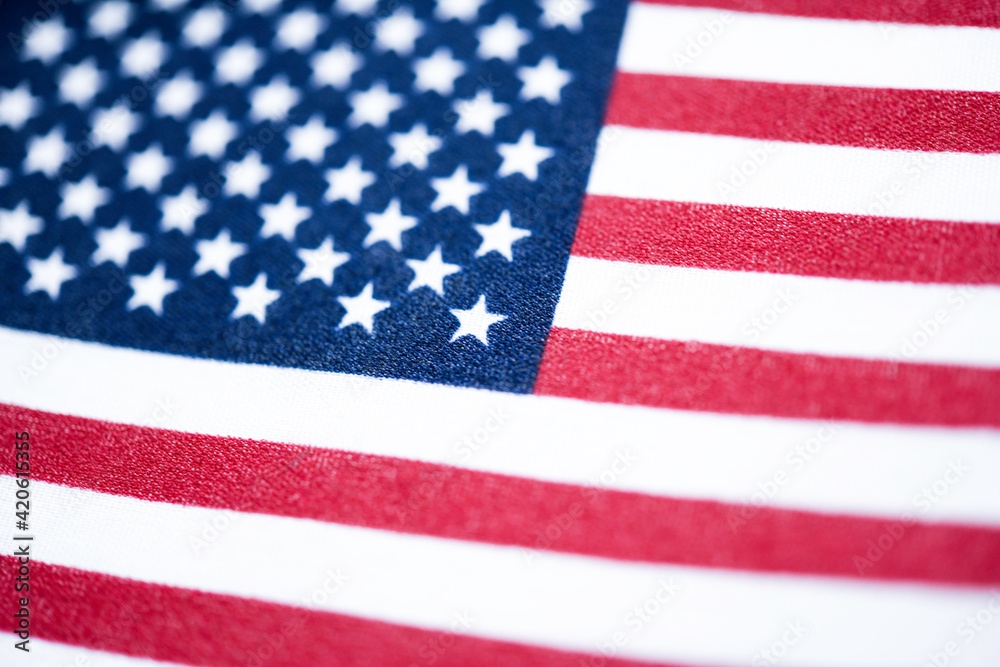 Fototapeta premium Macro Shot Of Handheld American Flag On Coarse Fabric