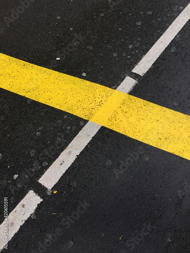 yellow and white lines on asphalt road photo