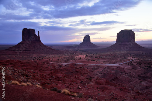 sunset in winter behind the spectacular mitten buttes and merrick butte from  the view hotel in  the navajo tribal park of monument valley  utah 