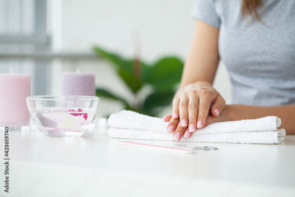 Woman making manicure when resting at home Woman making manicure when resting at home