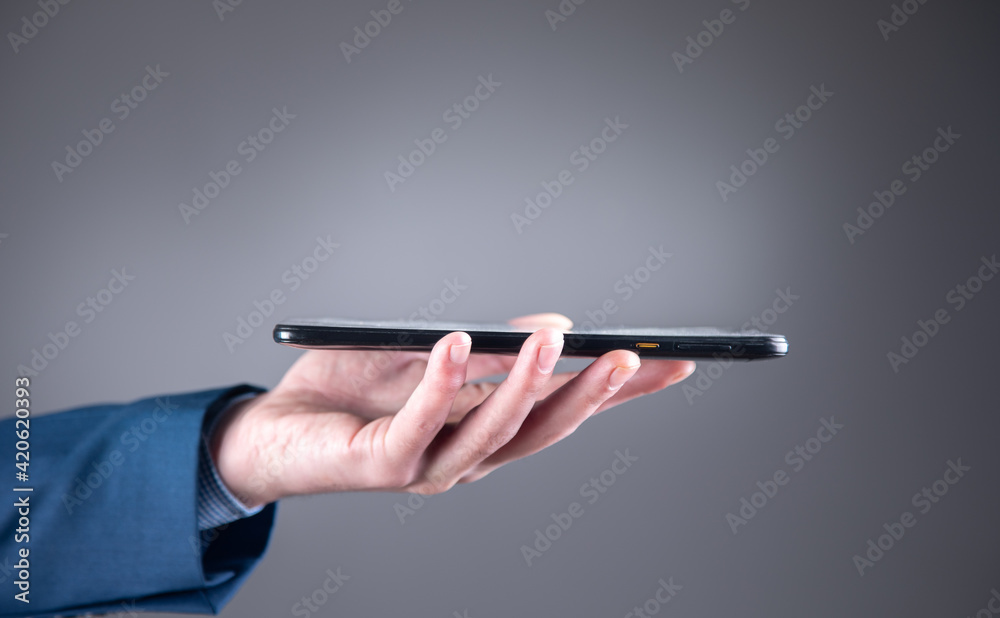 Young man holding smart phone Young man holding smart phone