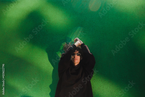 Woman on green floor photo