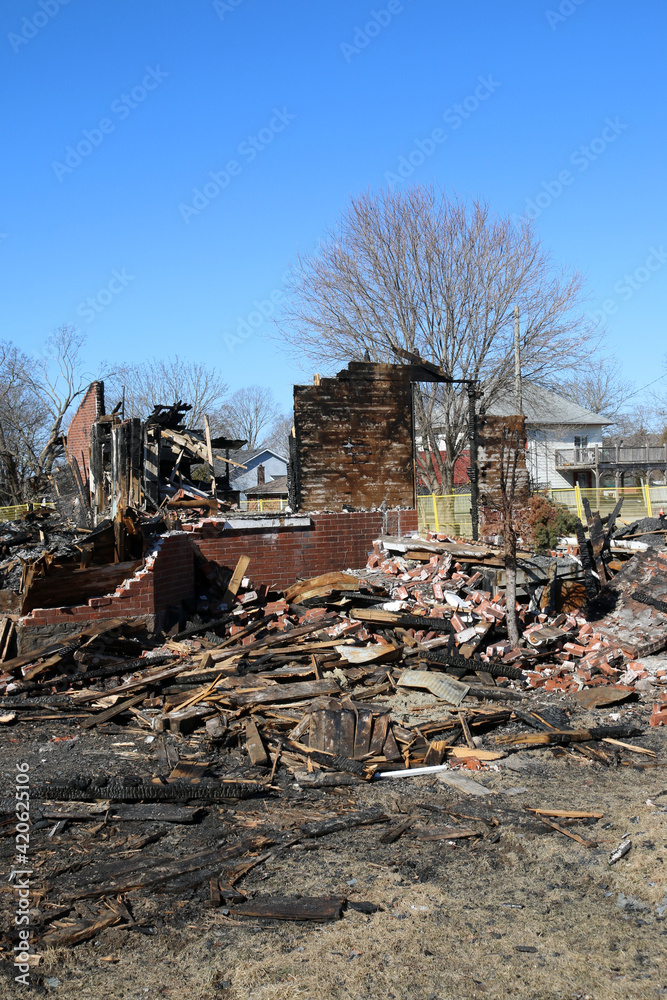 Burned out building, the remnants of a restaurant that was in a century house leaving heaps of rubble Burned out building, the remnants of a restaurant that was in a century house leaving heaps of rubble