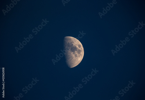 A half moon in the sky.